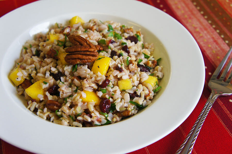 Whole grains rice salad with brown rice, mango, pecan and dried cranberries