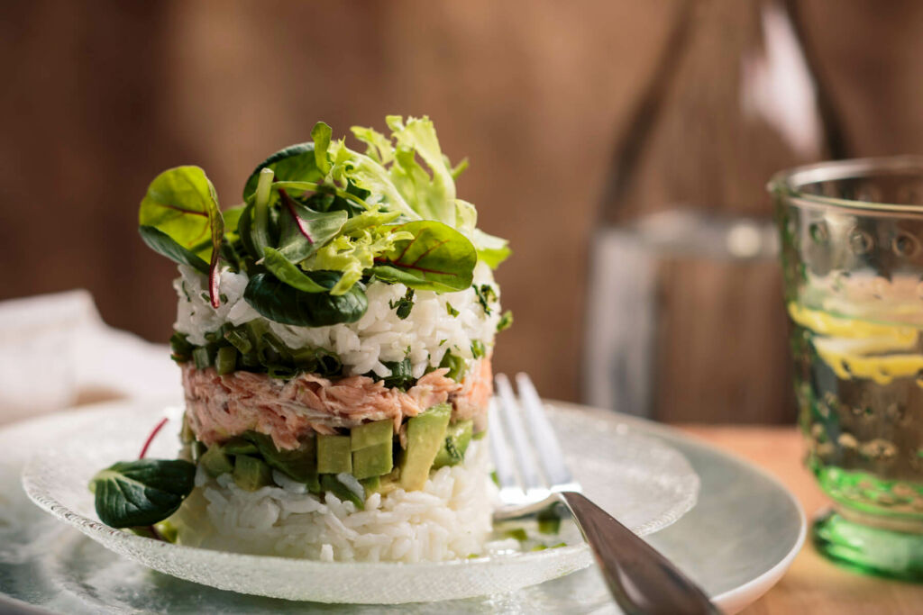 Jasmine Rice Towers with diced avocados, lettuce and spicy salmon