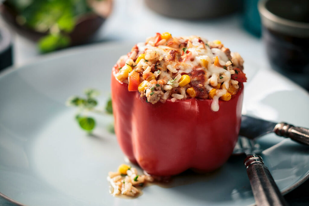 Rice and Turkey Stuffed Peppers with cheese and corn