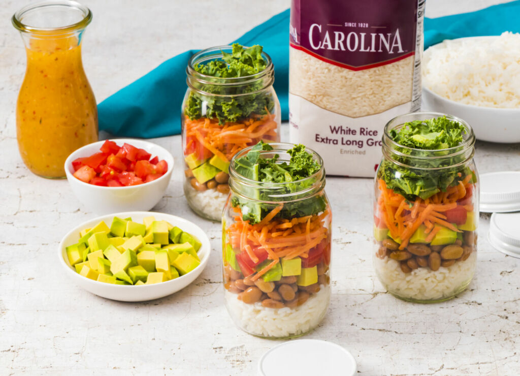 mason-jar-salad-with-white-rice-avocado-beans-tomatoes-carrots-and-kale