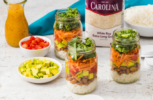 mason-jar-salad-with-white-rice-avocado-beans-tomatoes-carrots-and-kale